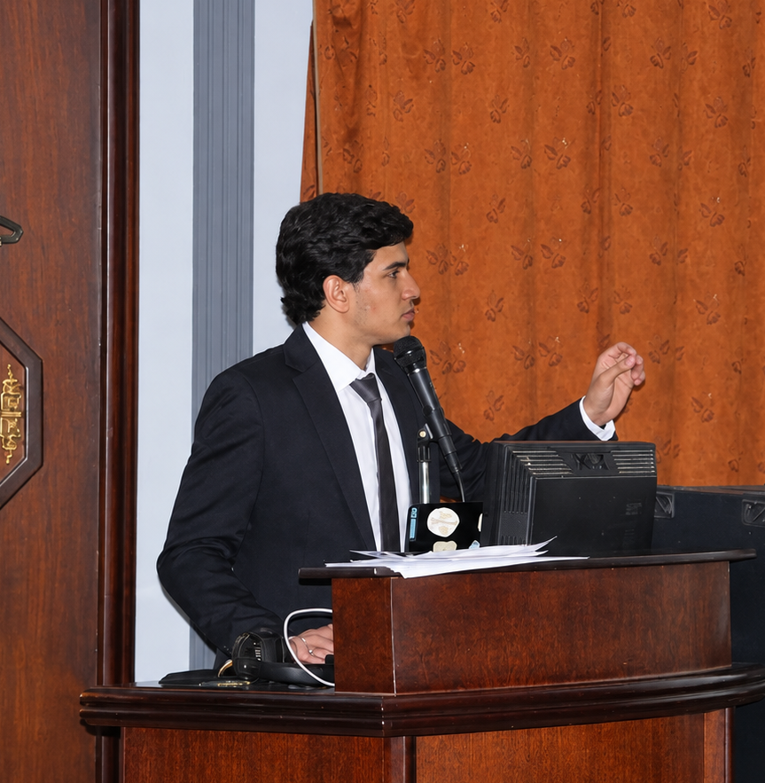 Motaz Al-Qawasma presenting the ICH meta-analysis at the podium, TSRC 2026